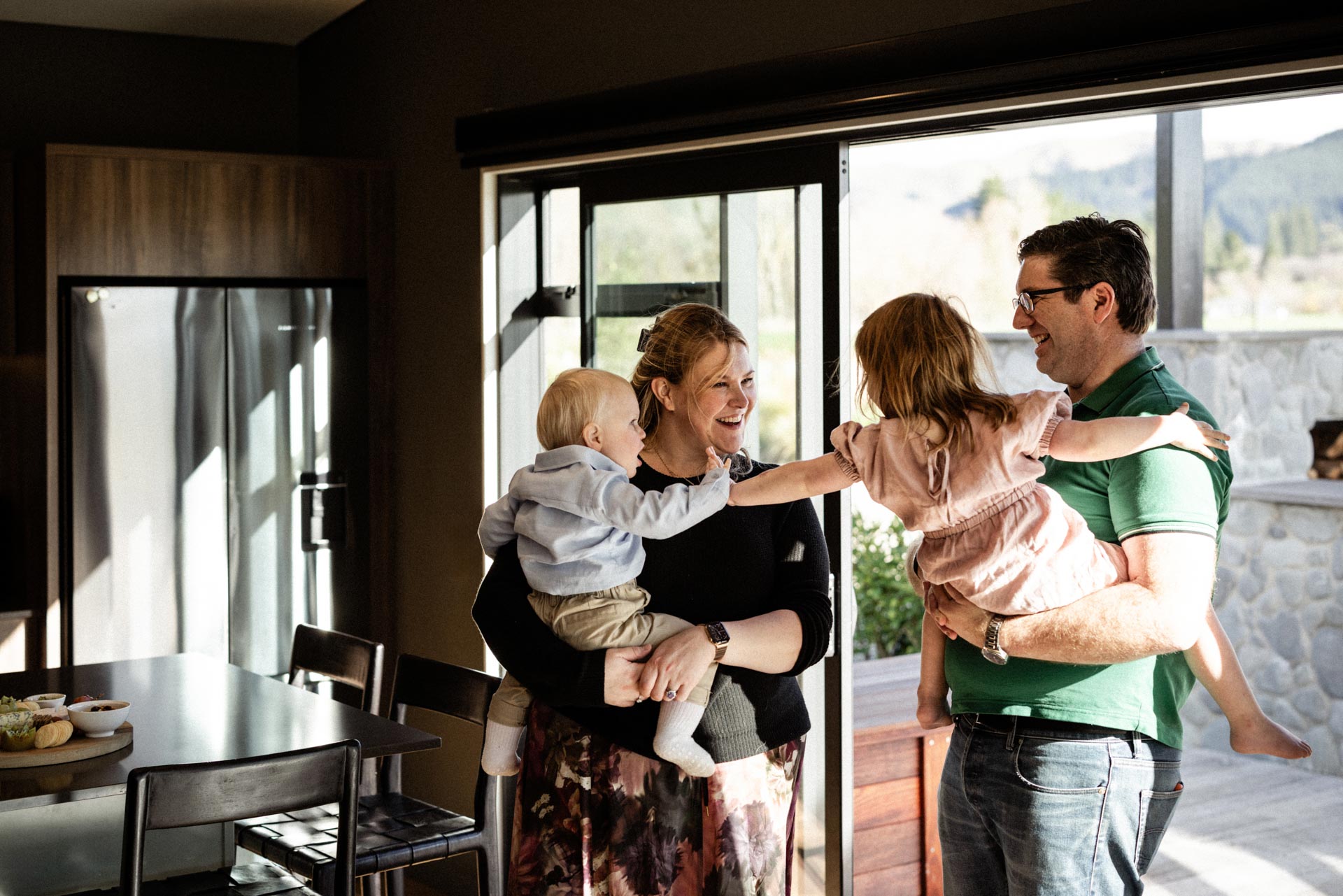 Family gathered in the kitchen at Whakahā