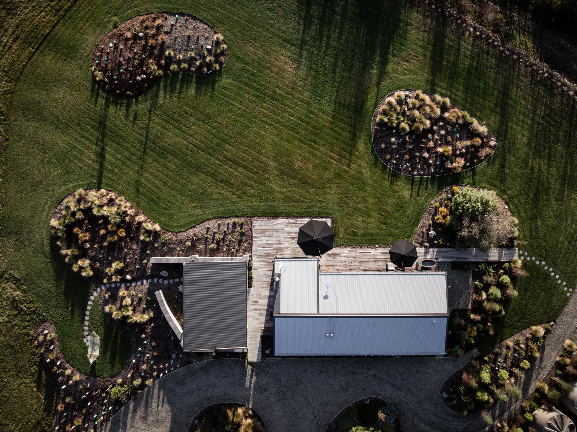 Aerial view of Whakahā's landscaped grounds and pavilion