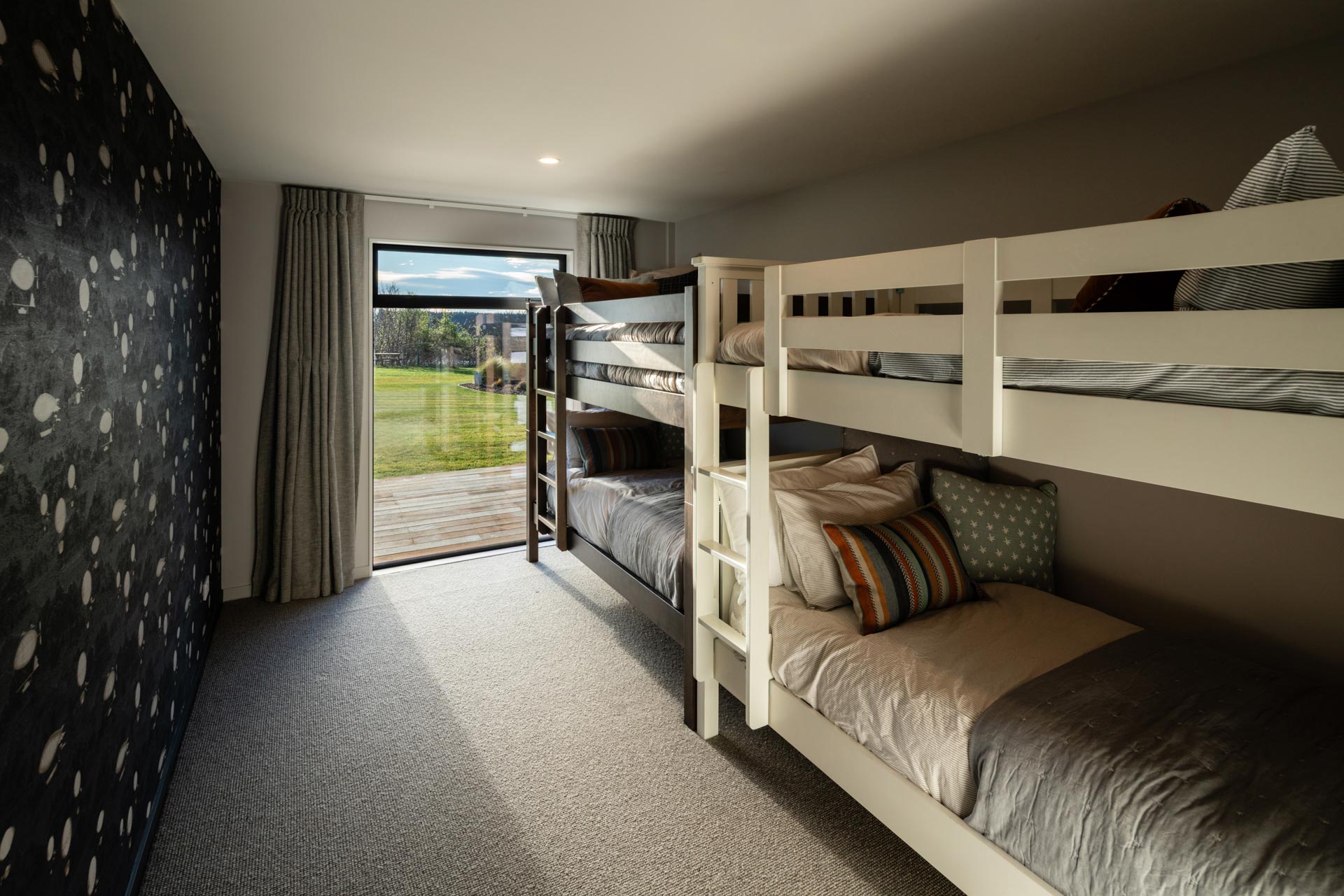 Bunk room with twin bunks and garden view