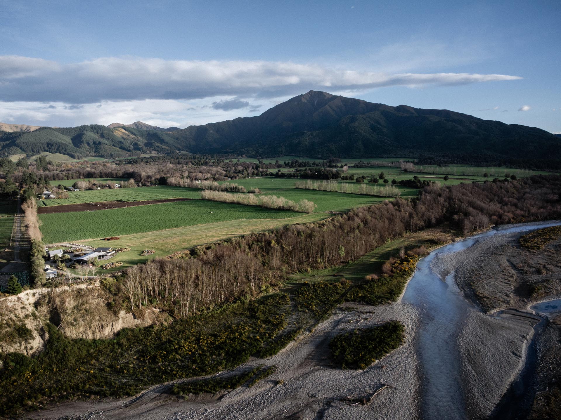 Aerial view of Whakahā and Mt Peel beyond